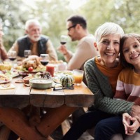 happy grandmother and granddaughter during family's lunch on a terrace. - food stock pictures, royalty-free photos & images