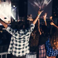 happy group of people jumping and dancing at music festival. view from behind - concert stock pictures, royalty-free photos & images
