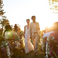 happy just married couple walking aisle amidst guests - garden decoration stock pictures, royalty-free photos & images