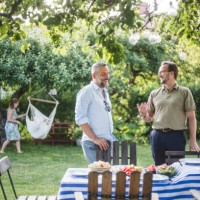 happy male friends spending weekend together during party in backyard - garden decoration photos et images de collection