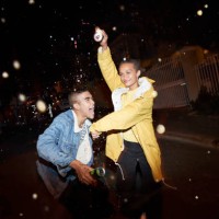 happy man and woman splashing drink - fashion stock pictures, royalty-free photos & images