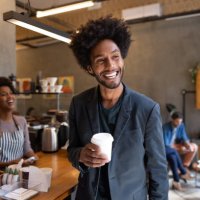 happy man at a cafe buying coffee to go - junk food stock pictures, royalty-free photos & images