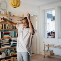 happy man dancing in living room at home - home decoration stock pictures, royalty-free photos & images