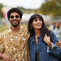 happy man walking with girlfriend at park - concert stock pictures, royalty-free photos & images