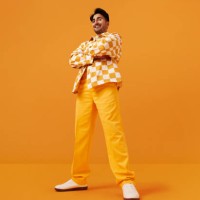 happy man with vitiligo standing with arms crossed - fashion stock pictures, royalty-free photos & images