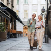 happy mature couple exploring a charming european city together - travel stock pictures, royalty-free photos & images