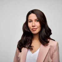 happy mixed race female brunette ceo wearing pink blazer. - hairstyle photos et images de collection