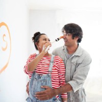 happy multi-ethnic couple renovating home - home decoration stock pictures, royalty-free photos & images