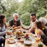 happy multi-generation family enjoying in lunch on a terrace. - food stock pictures, royalty-free photos & images
