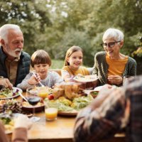 happy multi-generation family having lunch in nature. - food stock pictures, royalty-free photos & images