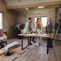 happy parents talking to an architect during home renovation process. - home decoration stock pictures, royalty-free photos & images