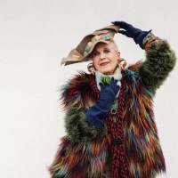 happy senior woman wearing colorful fur posing over white background, new york city - fashion stock pictures, royalty-free photos & images