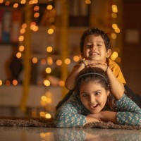 happy siblings lying on carpet at home - home decoration stock pictures, royalty-free photos & images