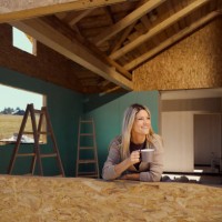 happy woman drinking coffee on a window frame of a built structure. - home decoration stock pictures, royalty-free photos & images