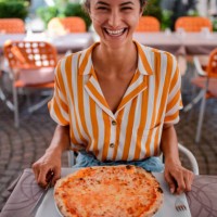 happy woman eating pizza. - food stock pictures, royalty-free photos & images