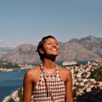 happy woman enjoying sunlight on face during vacation - travel stock pictures, royalty-free photos & images