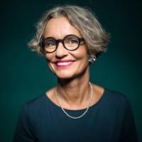 happy woman in eyeglasses against green background - fashion stock pictures, royalty-free photos & images