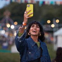 happy woman photographing through mobile phone - concert stock pictures, royalty-free photos & images