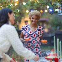 happy women friends setting table for dinner garden party - garden decoration stock pictures, royalty-free photos & images