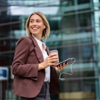 happy young businesswoman in the city on the go - junk food stock pictures, royalty-free photos & images