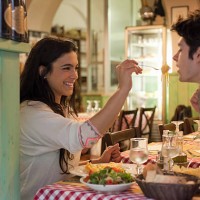 happy young couple eating together in restaurant - food stock pictures, royalty-free photos & images