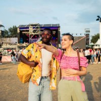 happy young couple is enjoying at a music festival - concert stock pictures, royalty-free photos & images