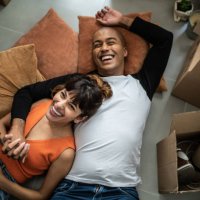 happy young couple lying on the floor at new home - home decoration stock pictures, royalty-free photos & images
