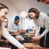 happy young friends eating pizza in college dorm room - junk food stock pictures, royalty-free photos & images