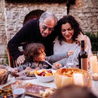 happy young grandson having lunch at grandparents rustic house - food stock pictures, royalty-free photos & images