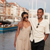 happy young man and woman walking on pier - fashion stock pictures, royalty-free photos & images