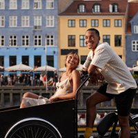 happy young man with girlfriend in cargo bike - travel stock pictures, royalty-free photos & images