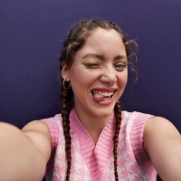 happy young woman winking and sticking tongue out taking selfie - fashion stock pictures, royalty-free photos & images