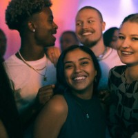 happy young women and men dancing in club on weekend at night - concert stock pictures, royalty-free photos & images