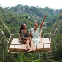 happy young women enjoying swinging during vacation - travel stock pictures, royalty-free photos & images