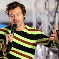 Harry Styles speaks onstage at NBC's 