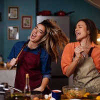 having a singing showdown while cooking dinner - food stock pictures, royalty-free photos & images