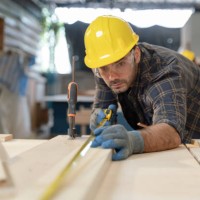 he is wearing a blue and black plaid shirt - home decoration stock pictures, royalty-free photos & images
