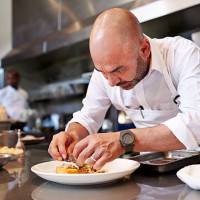 head chef finishing dish in kitchen at restaurant - food stock pictures, royalty-free photos & images