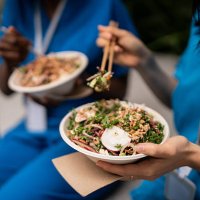 healthcare workers enjoying asian cuisine on outdoor lunch break - junk food stock pictures, royalty-free photos & images