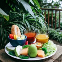 healthy breakfast with tropical fruits, juices and sweets - garden decoration stock pictures, royalty-free photos & images