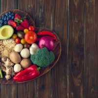 healthy food on a heart shape cutting board - food stock pictures, royalty-free photos & images