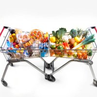 healthy food versus unhealthy food in opposing supermarket trollys - junk food stock pictures, royalty-free photos & images