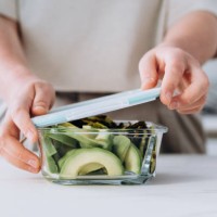 healthy lunch at the lunch box zucchini pancakes and avocado salad , healthy lunch to go for school and college students - junk food stock pictures, royalty-free photos & images