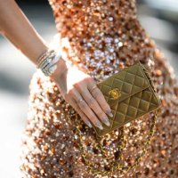 Heart Evangelista wears a beige brown with embroidered brown / green / silver sequined shoulder-off / puffy short dress, diamonds large rings, white...