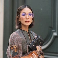Heart Evangelista wears glasses, earrings, a leather bag outside Louis Vuitton, during the Womenswear Fall/Winter 2024/2025 as part of Paris Fashion...