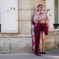 Heart Evangelista wears light pink pattern Acne Studios scarf, light pink cropped Acne Studios sweater, burgundy bordeaux high waisted bow Acne...