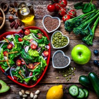 heart shape salad plate on rustic wooden table - food stock pictures, royalty-free photos & images