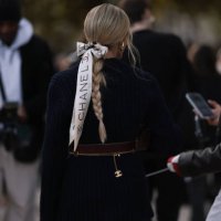 Helena Bordon is seen wearing a blue blazer with a brown belt and a gold narrow belt by Chanel, plus a white hairband by Chanel with a bow in her...