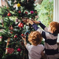 helping mum with the tree - home decoration stock pictures, royalty-free photos & images