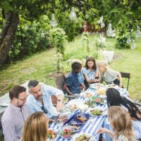 high angle view of friends and family enjoying at dining table in garden party - garden decoration photos et images de collection